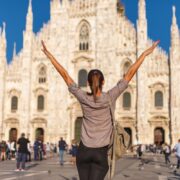 Woman standing in front of the Milan Duomo, Italy